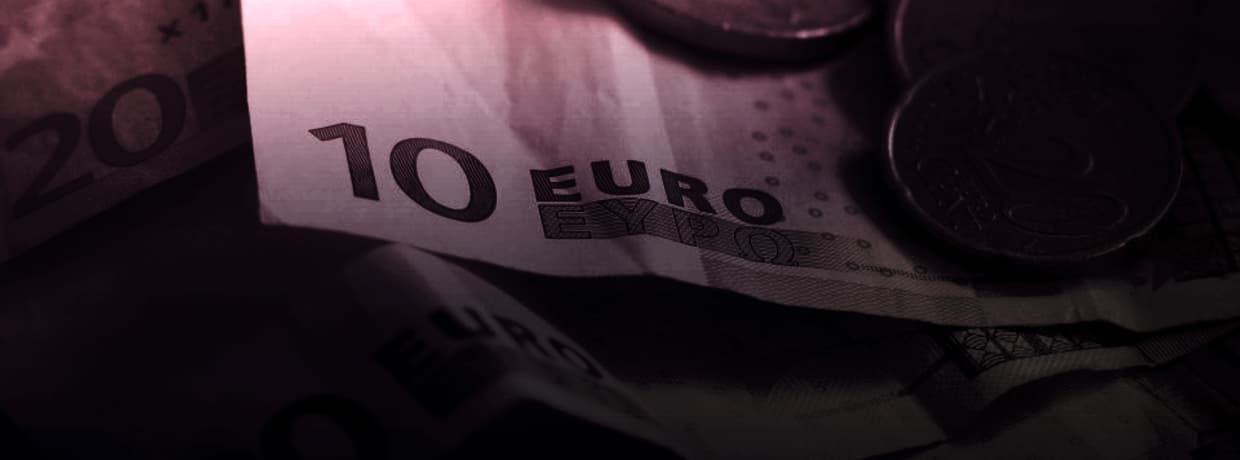 Euro banknotes photographed close up, illustrating subscription billing in euros